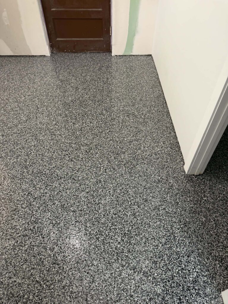 Finished basement with seamless epoxy floor